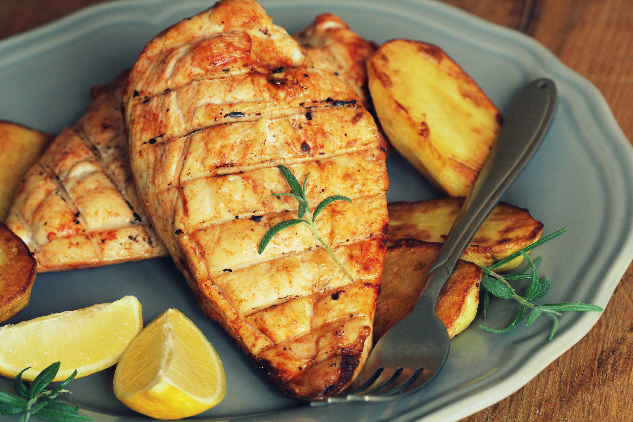 Grilled Chicken Breast with Fried Potato and Lemon